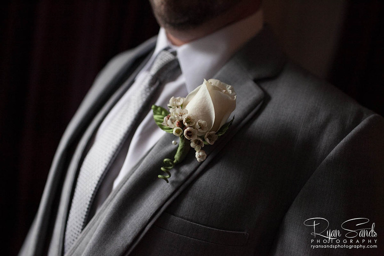 Grand Summit Hotel Wedding - A detail image of the groom with his flower pinned on his jacket.